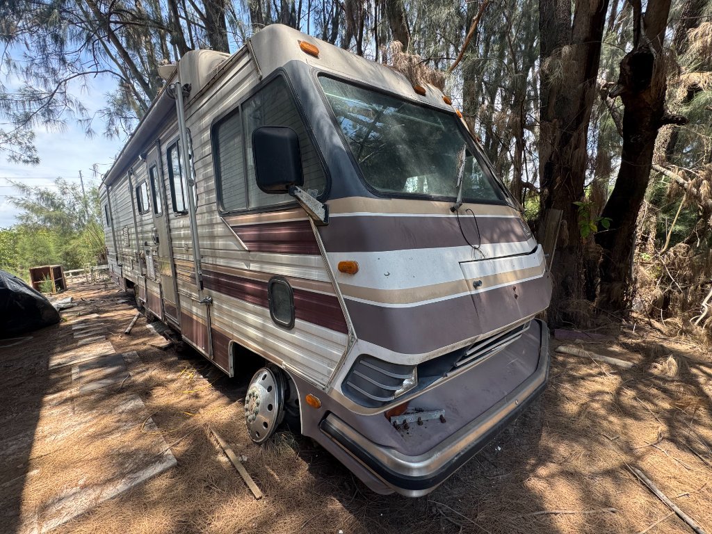 Older motorhome being assessed for safe removal