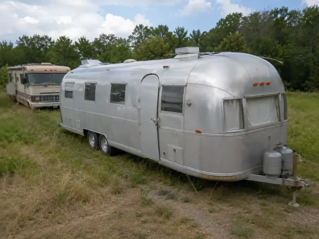Vintage travel trailer awaiting removal